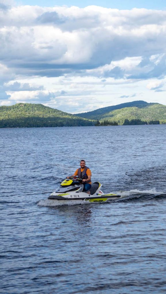 A man riding a jet ski on a lake.